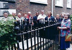Trustees standing near grave of Richard Cloudesley